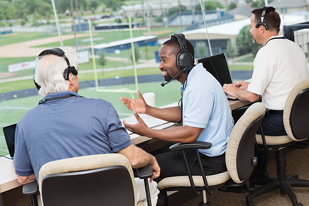 Group of sports reporters and commentators discussing football game